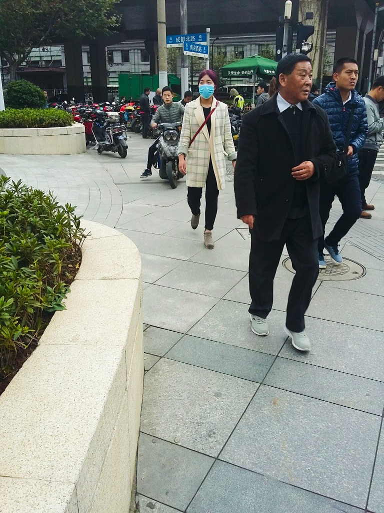 Shanghai pavement-riding scooterist