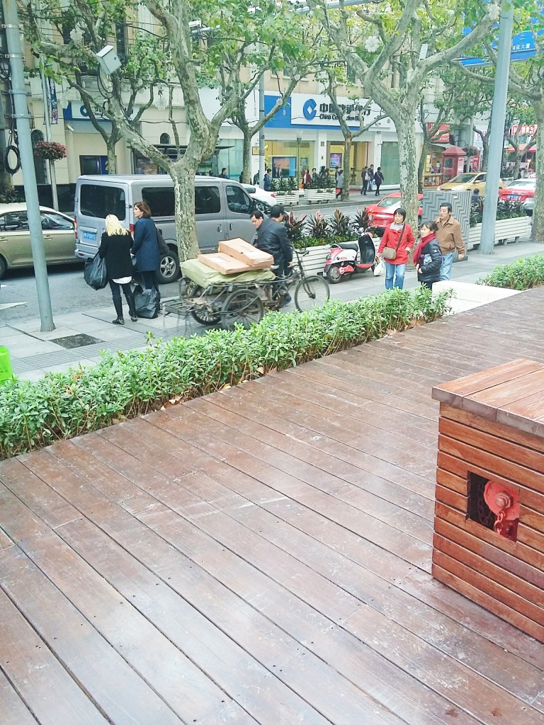 Shanghai pavement-riding scooterist